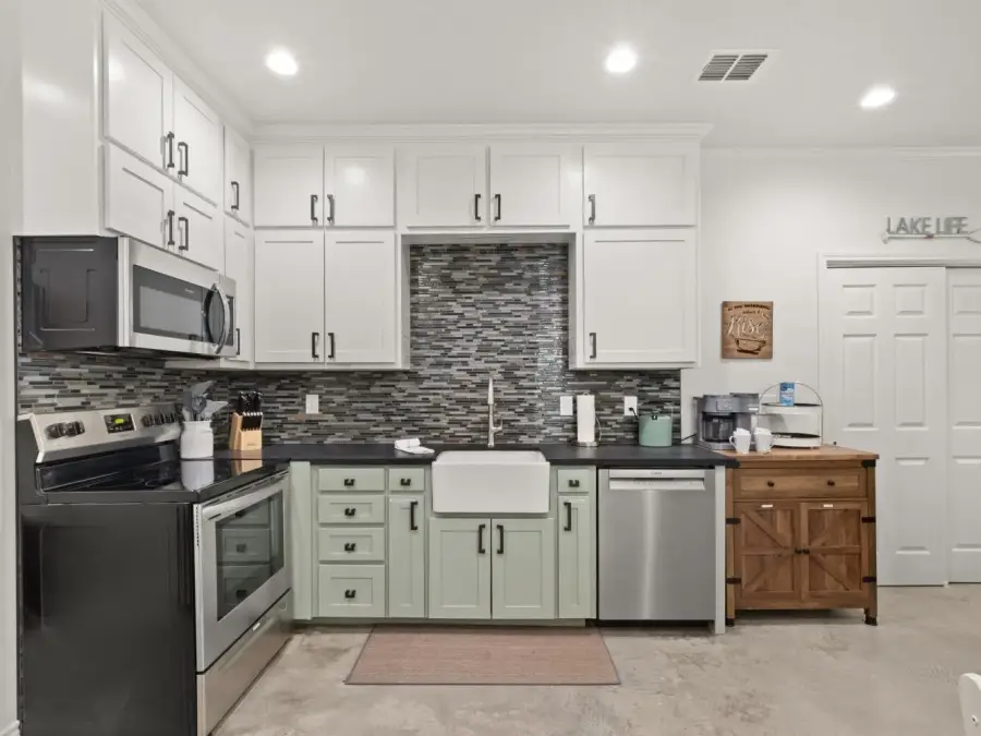 The kithcn has a generous supply of utensils and cookware. The kithcn has a generous supply of utensils and cookware.