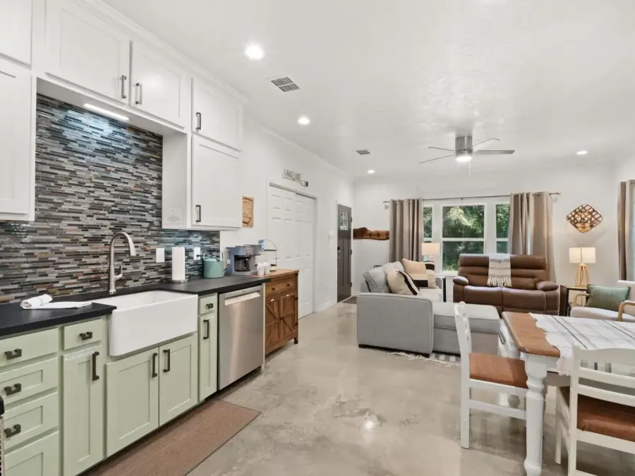 View of kitchen, dining, and living area from the hallway. View of kitchen, dining, and living area from the hallway.