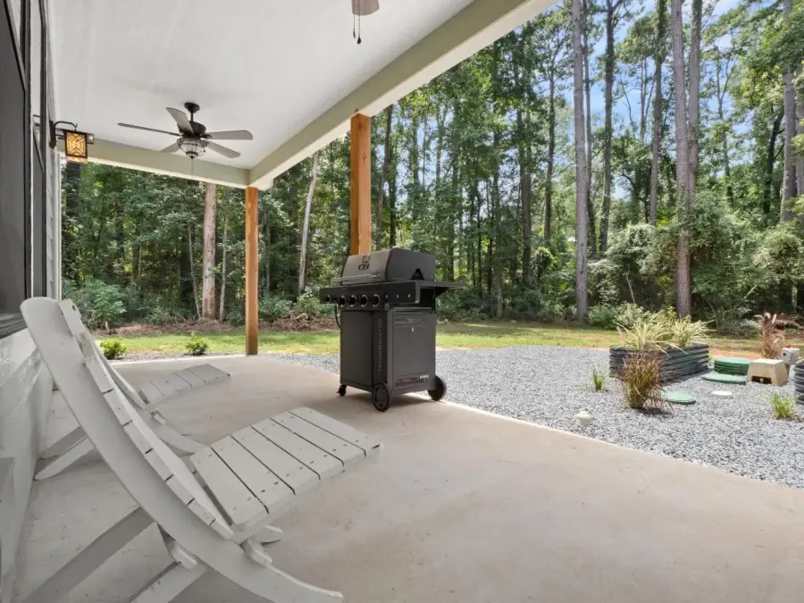 The back porch has some scenic view and a gas grill. The back porch has some scenic view and a gas grill.