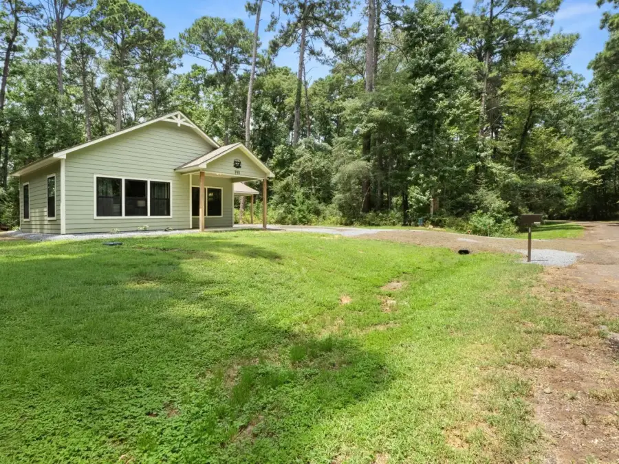 View of Peaceful Pine Bungalow as you drive up on Ensign Drive. View of Peaceful Pine Bungalow as you drive up on Ensign Drive.